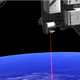 Ilustración para el artículo titulado La NASA transmite por primera vez vídeo por láser desde el espacio
